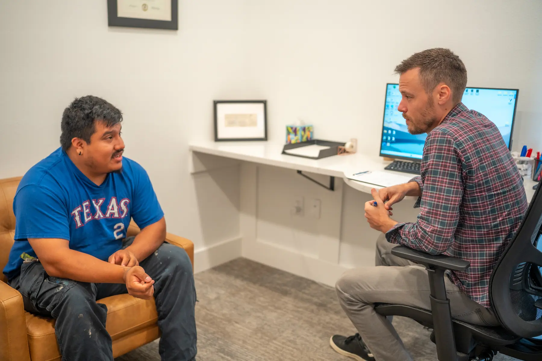 A patient consultation at True Works Chiropractic